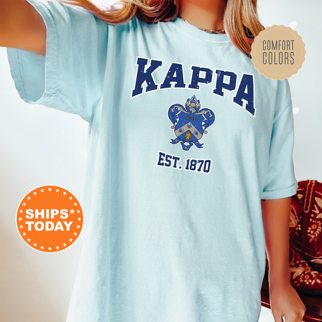 a woman wearing a blue kappa t - shirt
