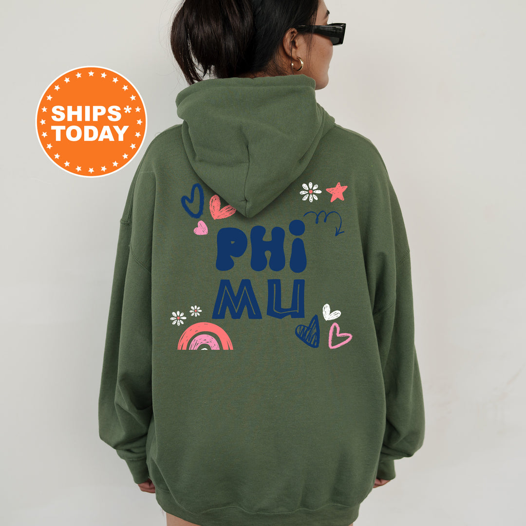 a woman wearing a green hoodie with the words phi muu on it