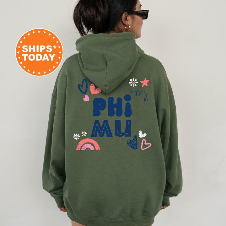 a woman wearing a green hoodie with the words phi muu on it