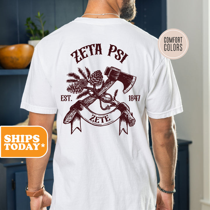 a man wearing a white shirt with an image of a hammer and two crossed axes