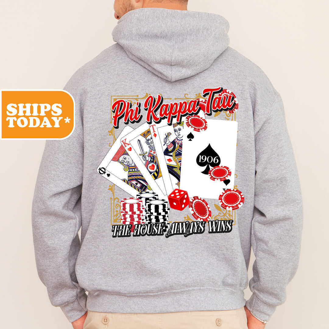 a man wearing a hoodie with a picture of playing cards on it