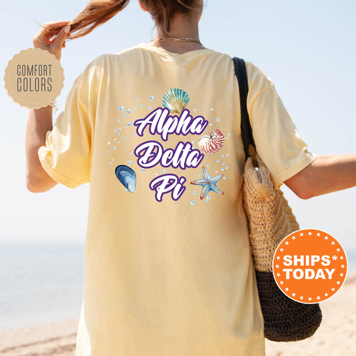 the back of a woman's yellow shirt that says alpaca delite