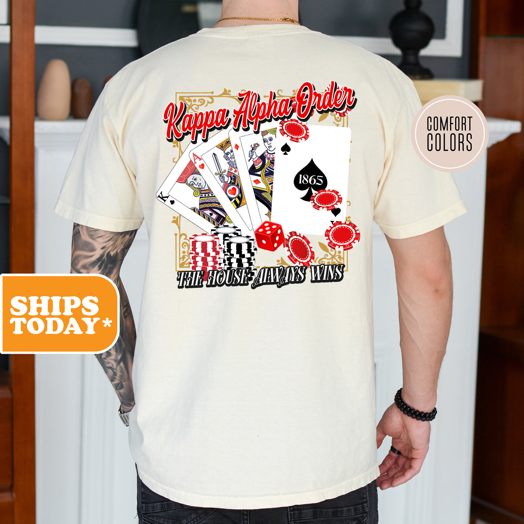 a man wearing a white shirt with a picture of playing cards on it