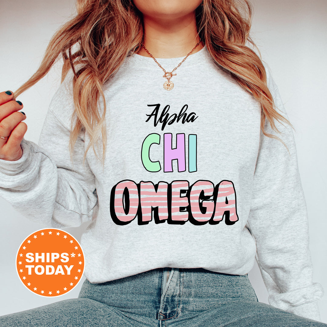 a woman wearing a sweatshirt that says ahha chi omega