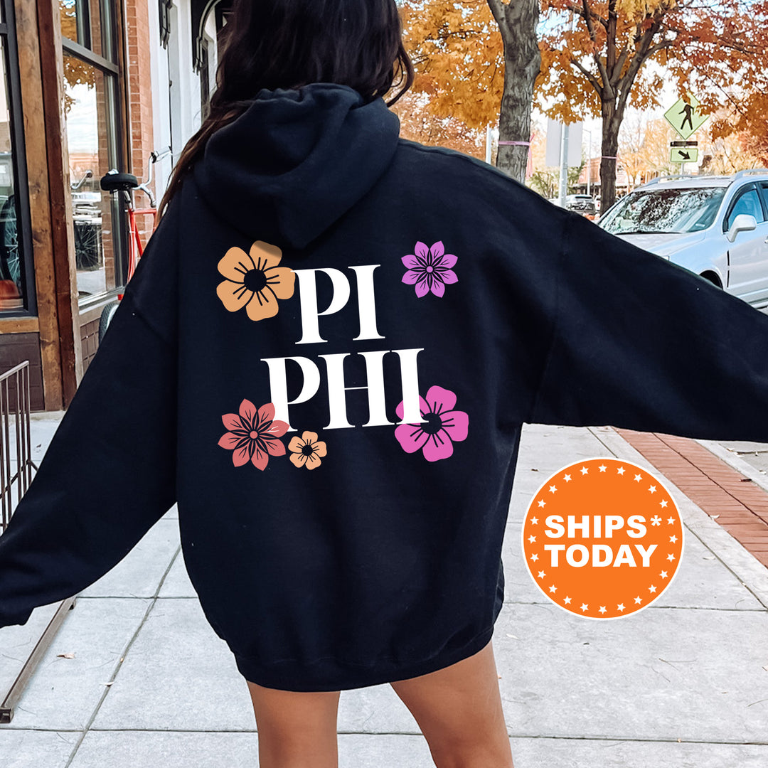 a woman is walking down the sidewalk wearing a hoodie