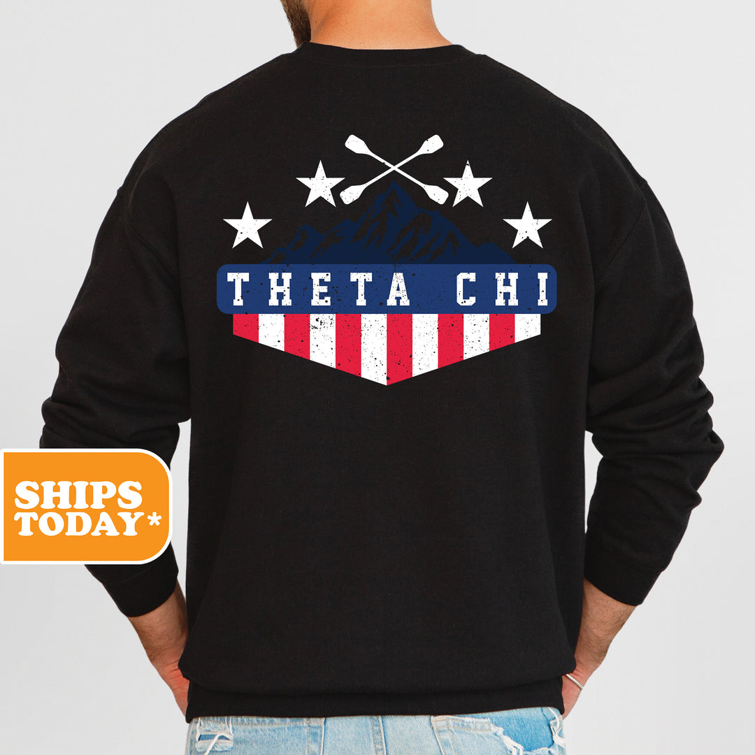 a man wearing a black sweatshirt with an american flag pocket