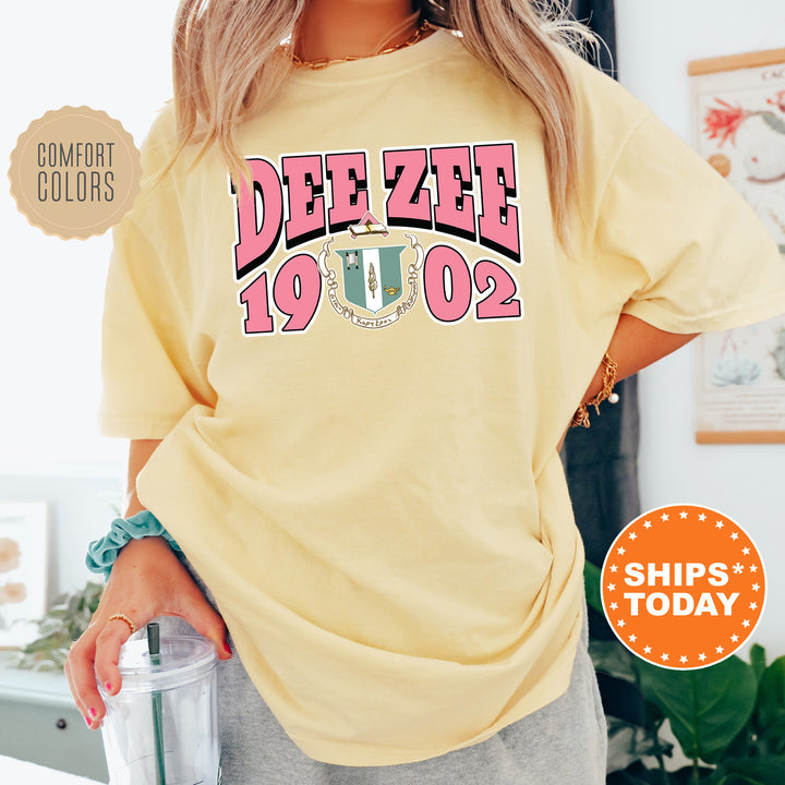 a woman wearing a yellow tee shirt with the words deeze on it