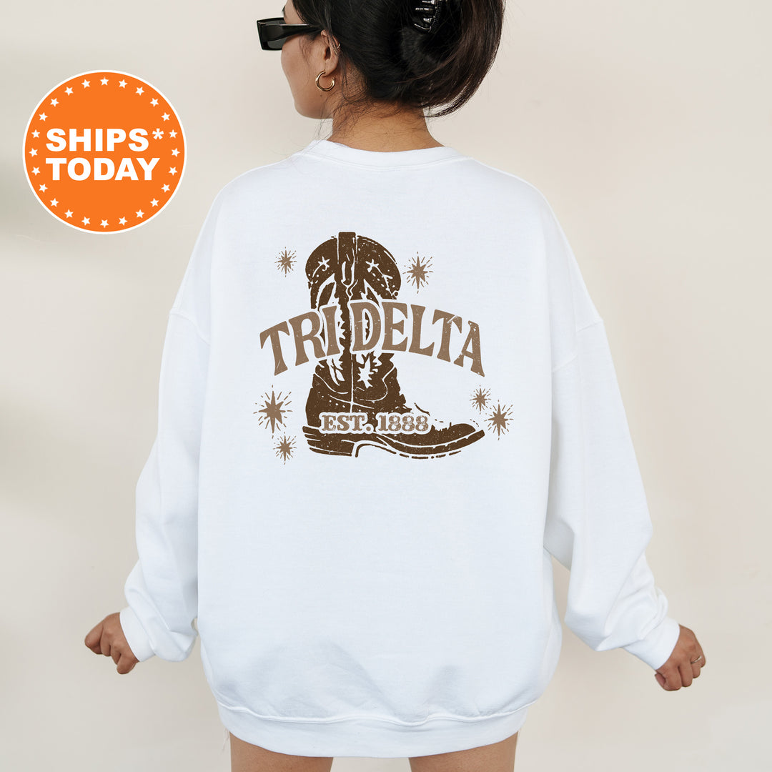 a woman wearing a white sweatshirt with the words trdella on it