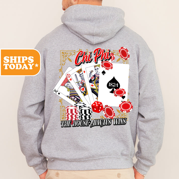 a man wearing a hoodie with playing cards on it