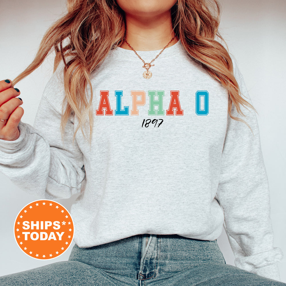 a woman with long hair wearing a sweatshirt and jeans