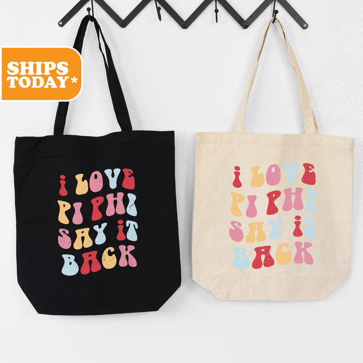 two shopping bags hanging on a wall