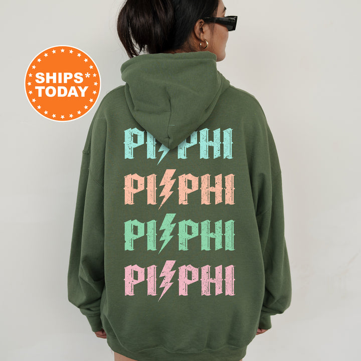a woman wearing a green sweatshirt with the words phi phi phi phi phi phi phi