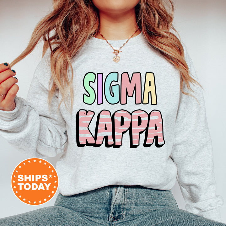 a woman wearing a sweatshirt that says stigma kappa