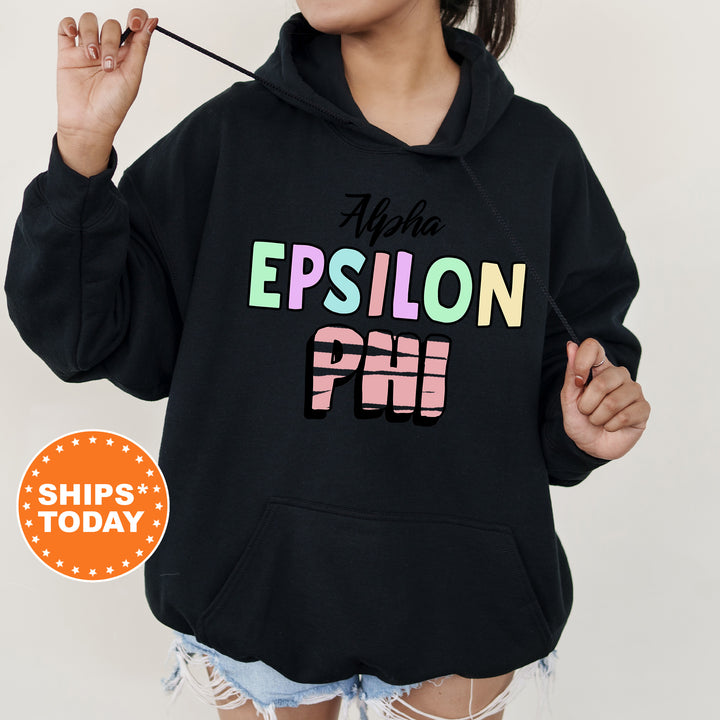 a woman wearing a black hoodie with the words epiloon printed on it