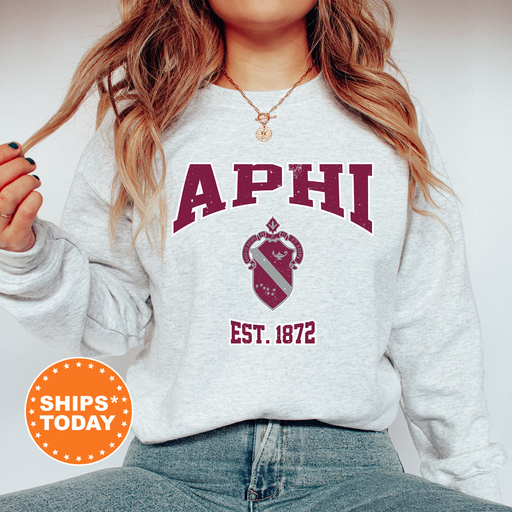 a woman wearing a sweatshirt with the words aphi on it