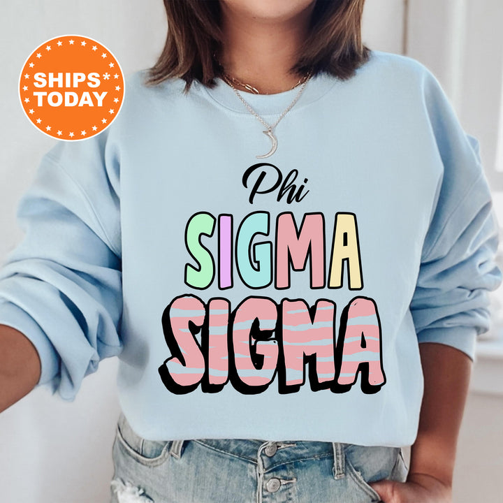 a woman wearing a sweatshirt that says phi sigma sigma