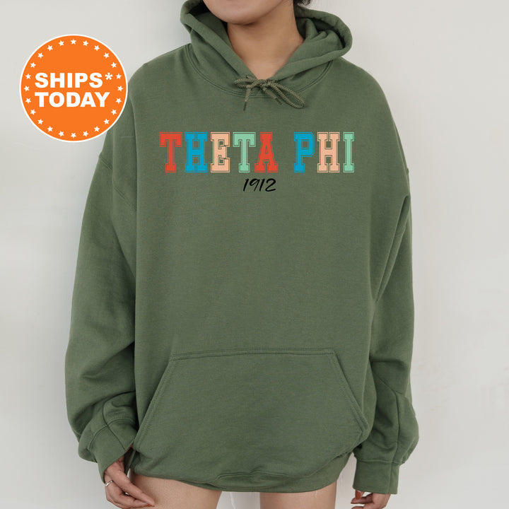 a woman wearing a green hoodie with the word thea phi printed on it