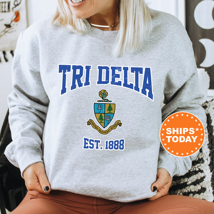a woman sitting on a chair wearing a sweatshirt