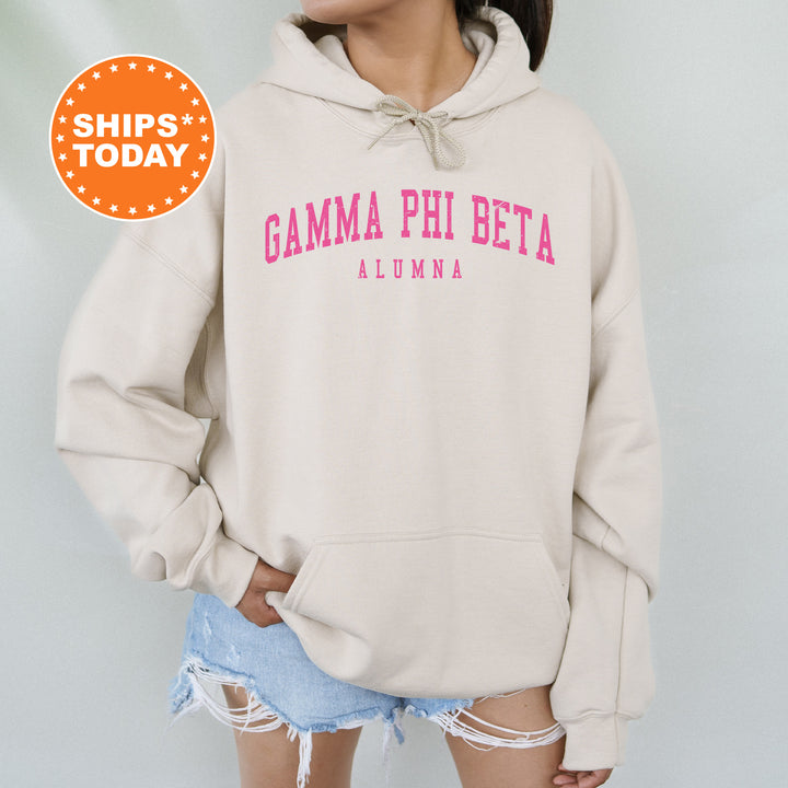 a woman wearing a sweatshirt with the words gama phi beta on it
