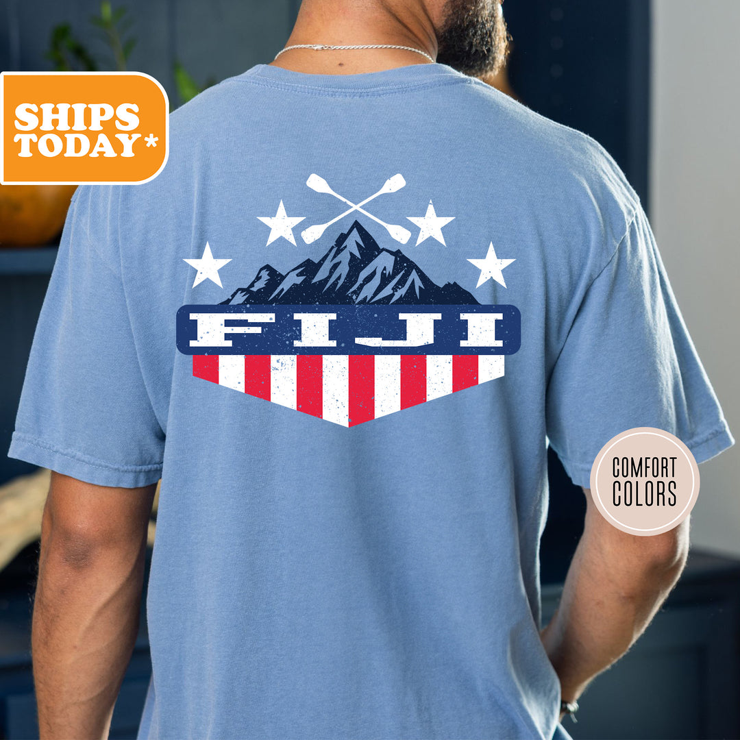 a man wearing a blue shirt with the american flag on it