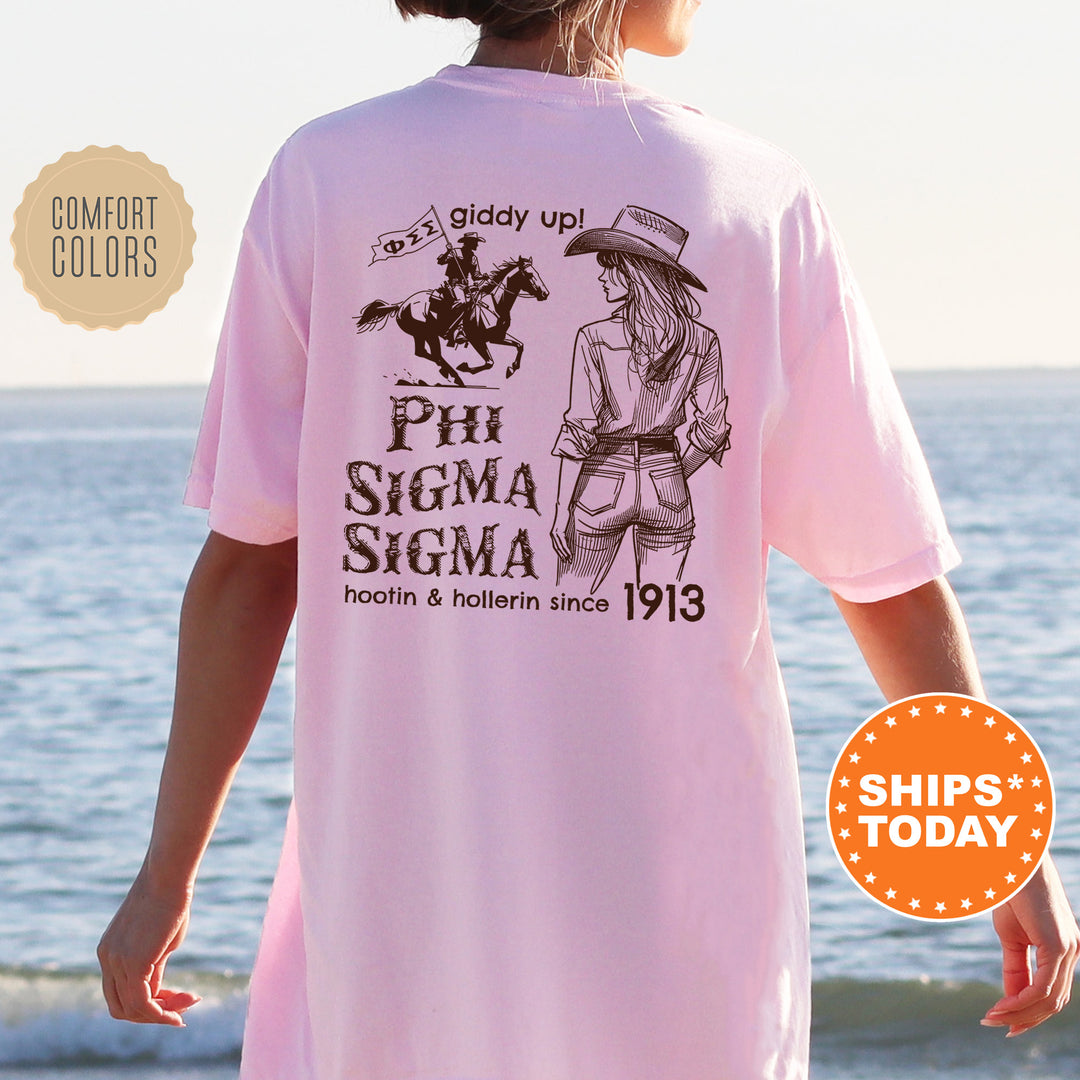 a woman wearing a pink shirt with a picture of a woman riding a horse