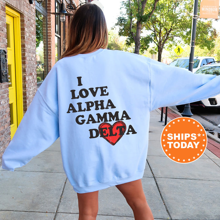 a woman walking down a sidewalk wearing a blue sweatshirt