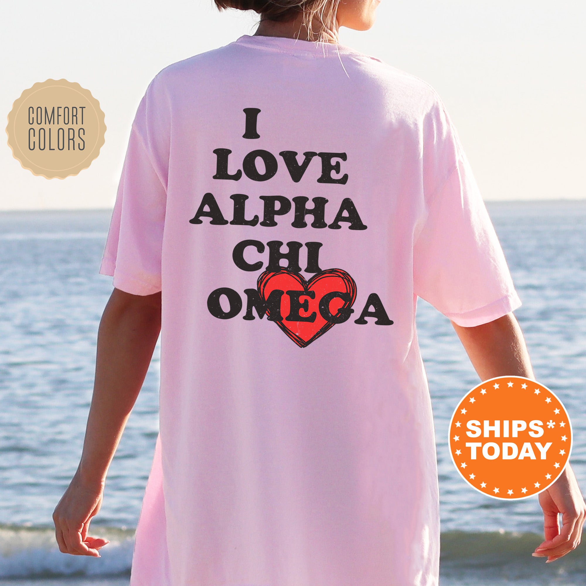 a woman wearing a pink shirt that says i love alpha chi omega
