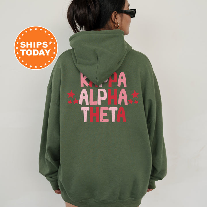 a woman wearing a green hoodie with pink letters on it