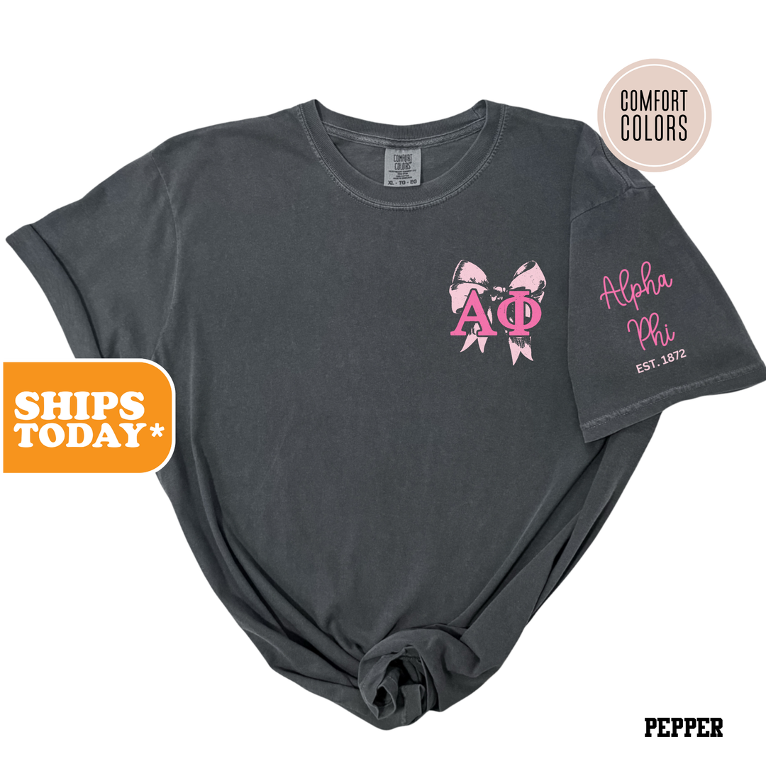 a black shirt with pink bows on it
