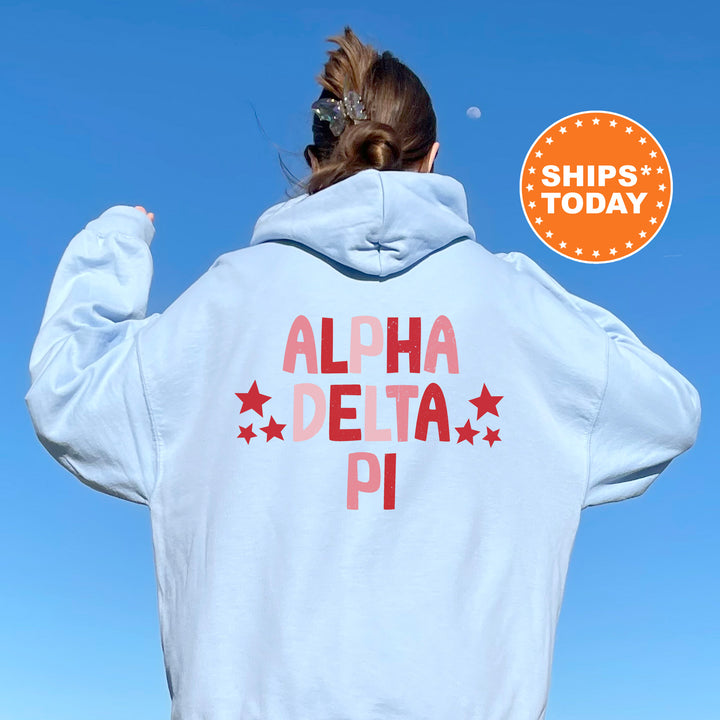 a woman wearing a white hoodie with the words aloh delta pi on it