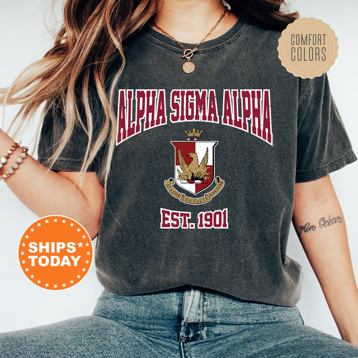 a woman wearing a black shirt with a gold eagle on it
