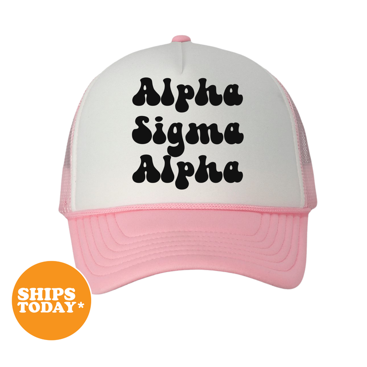 A white and pink baseball cap with the text "Alpha Sigma Alpha" printed on it.