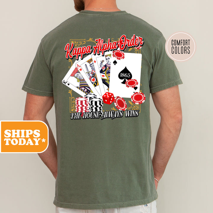 a man wearing a t - shirt with playing cards on it