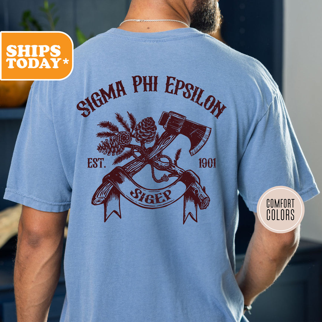 a man wearing a blue shirt with an image of a hammer and two crossed axes
