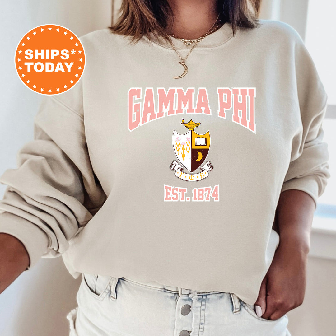 a woman wearing a sweatshirt with the words gama phi on it