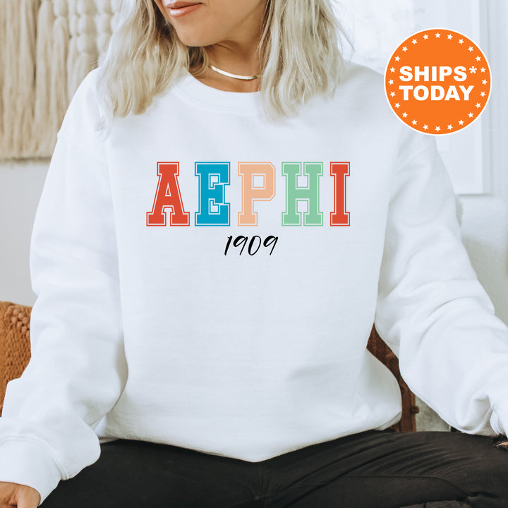 a woman wearing a white sweatshirt with the word aephh printed on it