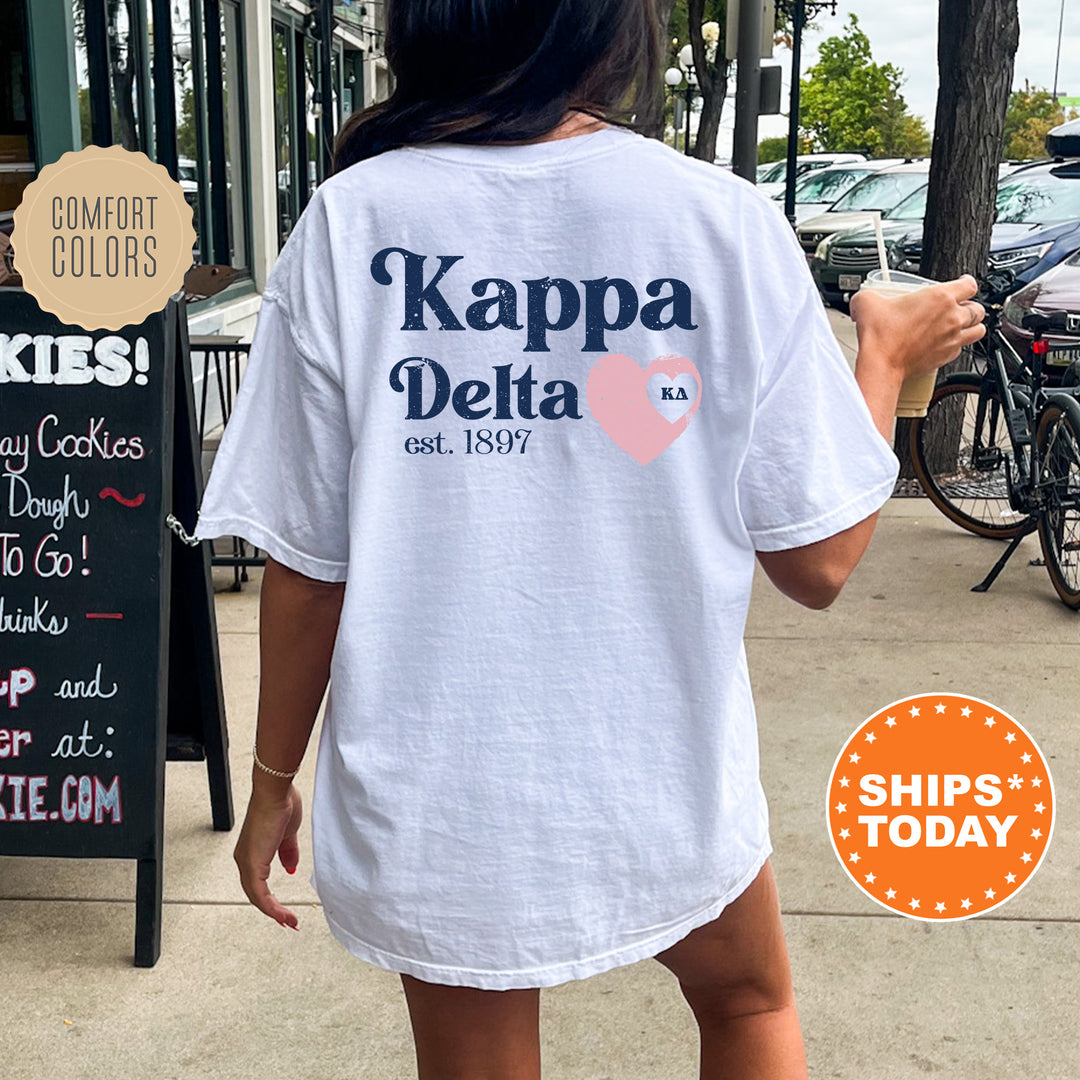 a woman walking down a sidewalk with a white shirt on