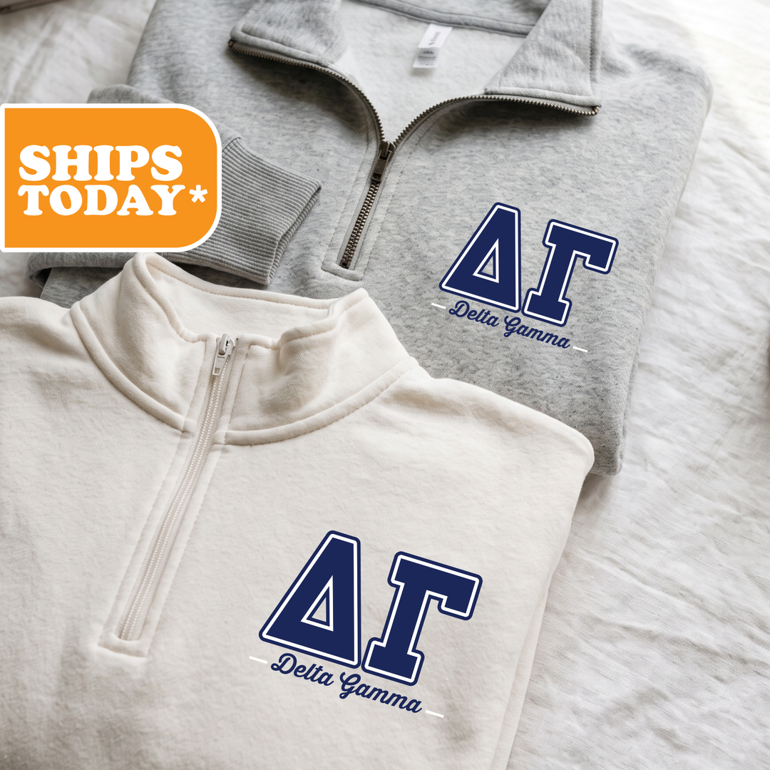 Two gray sweatshirts with the Delta Gamma sorority logo are displayed on a bed.