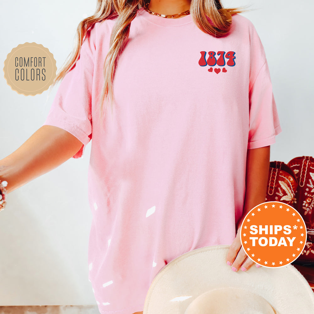 a woman wearing a pink shirt and hat