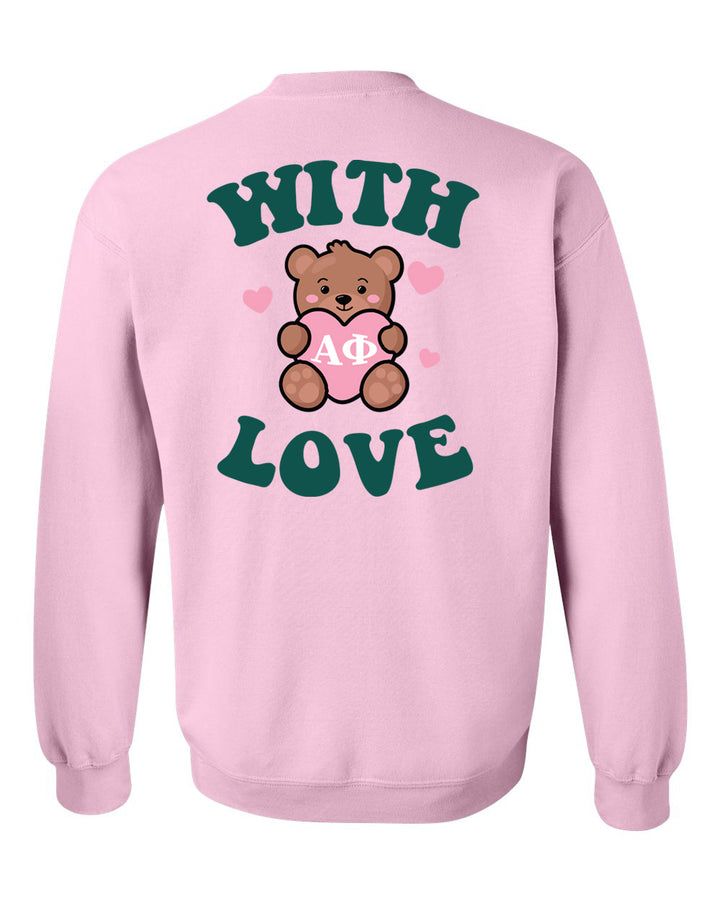 a pink sweatshirt with a teddy bear holding a heart