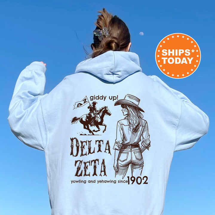 a woman wearing a white hoodie with a picture of a cowboy on it