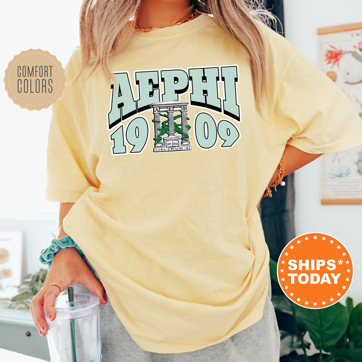 a woman in a yellow shirt holding a blender