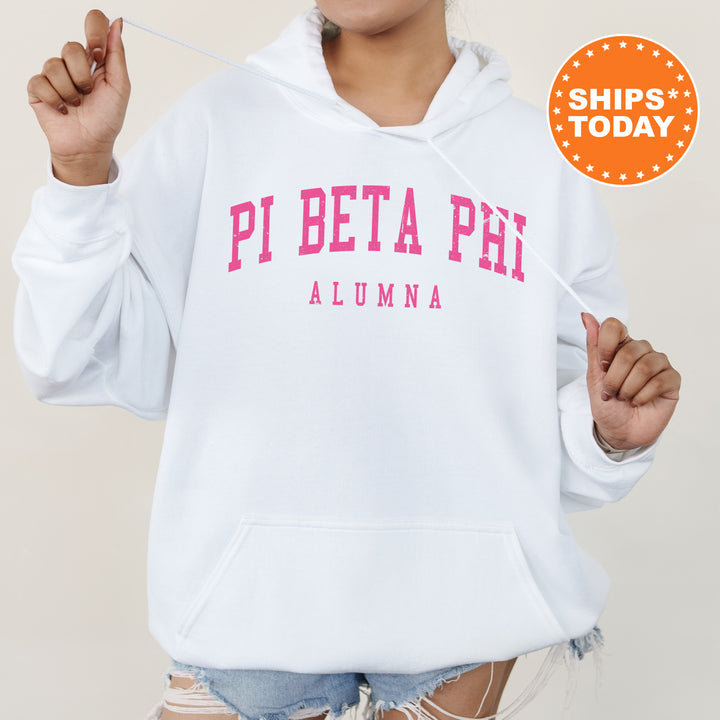 a woman wearing a white hoodie with pink letters on it