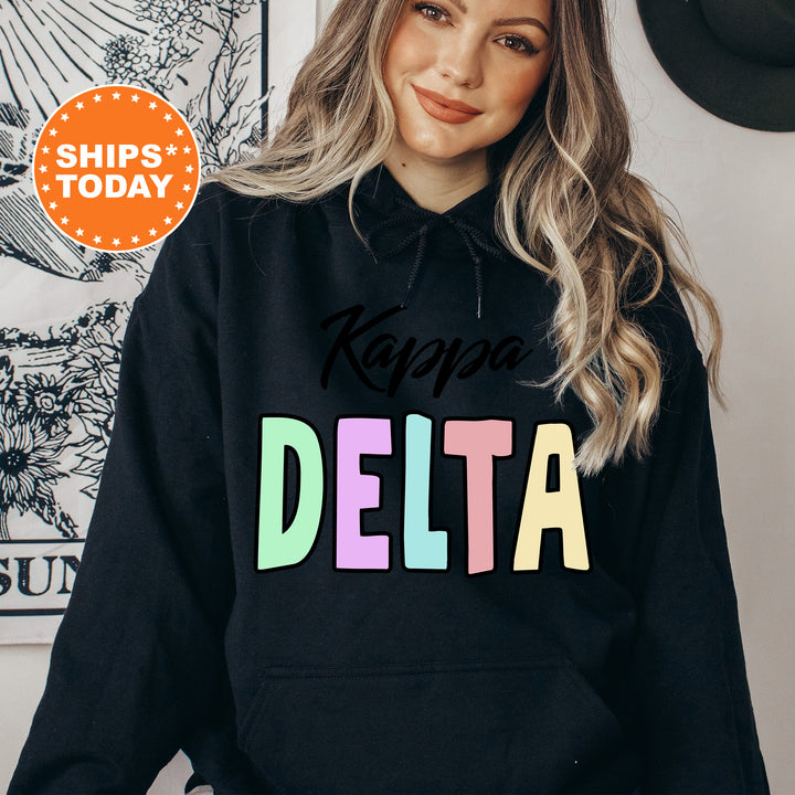 a woman wearing a black hoodie that says kapaa delta