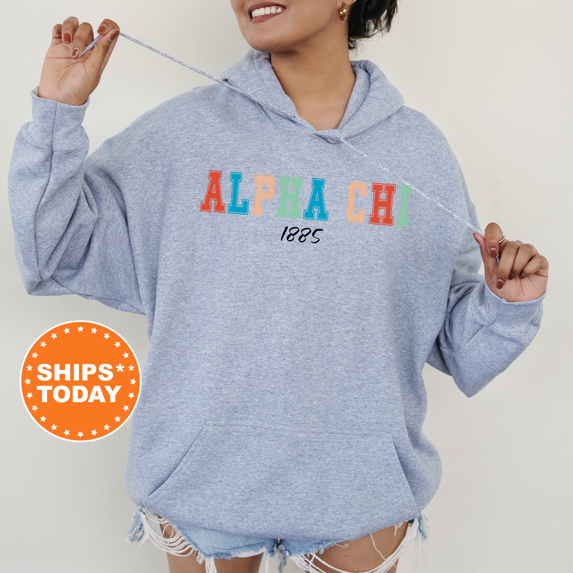 a woman wearing a blue sweatshirt with the word alpagh on it
