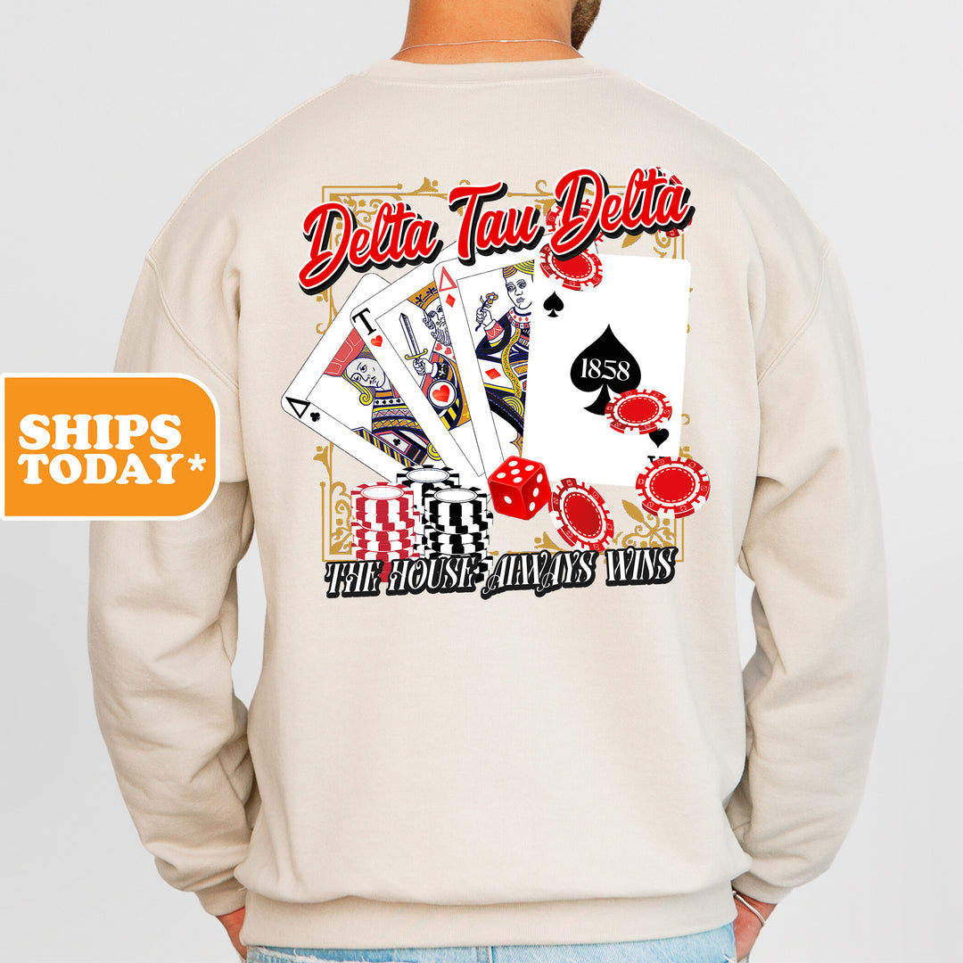 a man wearing a sweatshirt that has a picture of a deck of cards on it