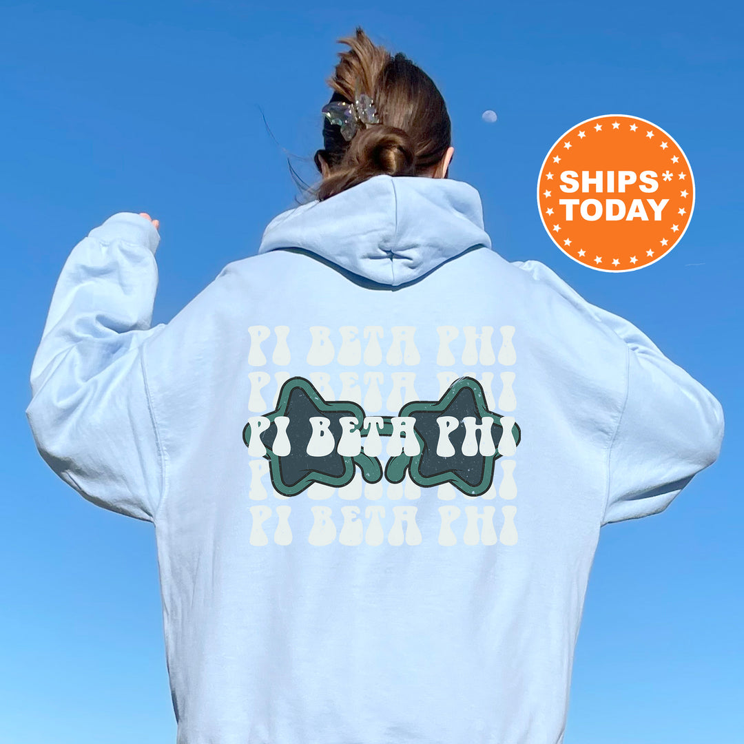 a woman wearing a white hoodie with a dog on it