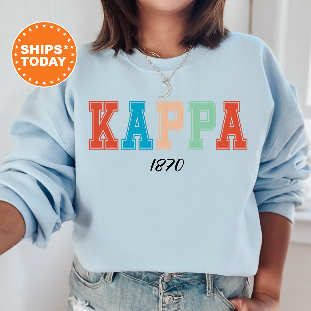 a woman wearing a sweatshirt with the words kappa printed on it