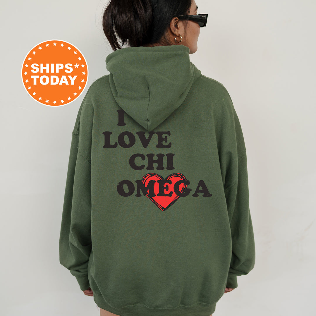 a woman wearing a green hoodie that says i love chi omega
