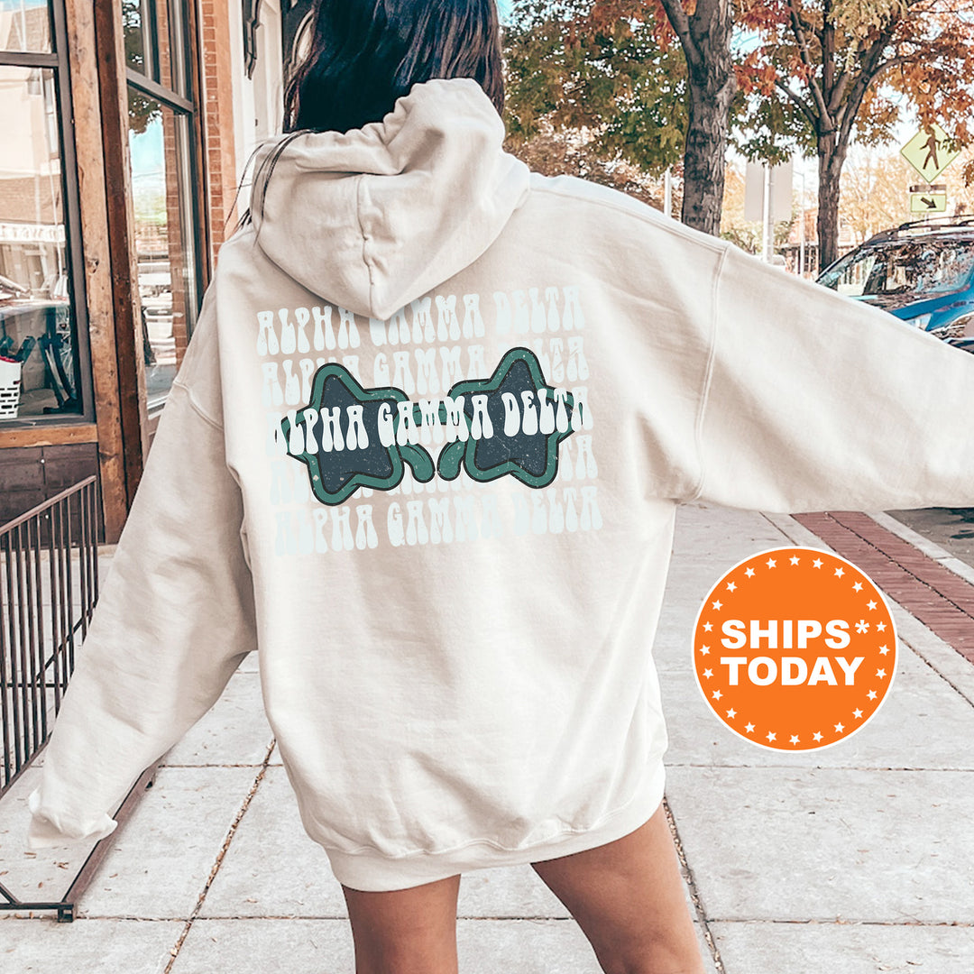 a woman walking down a sidewalk wearing a white hoodie